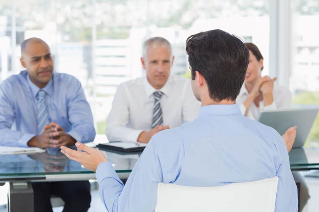 A businessman in a panel interview