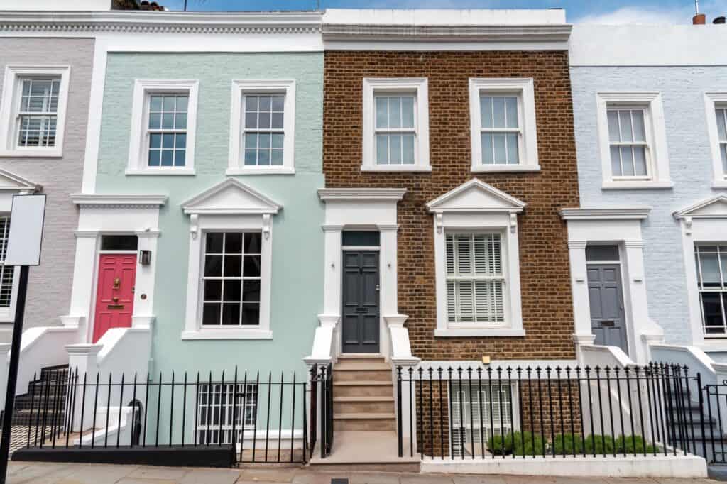 A row of coloured and brick houses